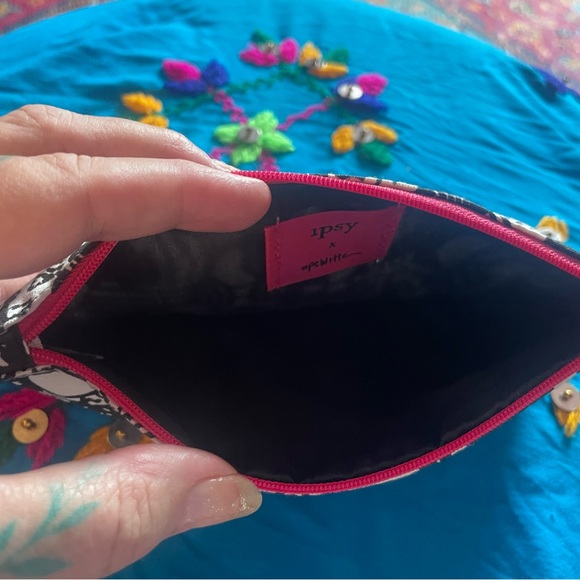 Large black and white Ipsy bag. Measures apx 5 x 9“. Excellent condition. - Picture 7 of 8